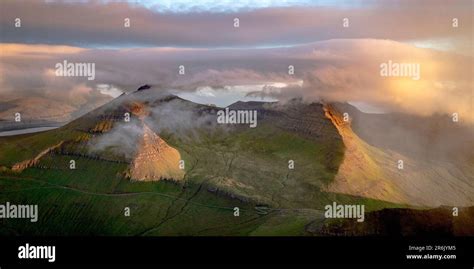 Foggy Sunrise Over Slaettaratindur Peak Highest Mountain Of Faroe