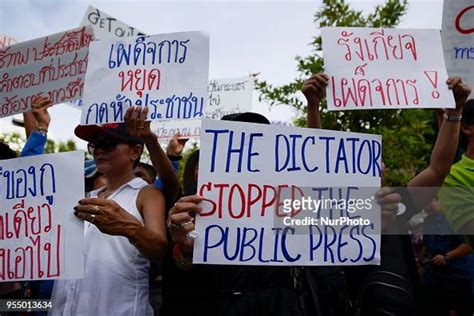 Thai Pro Democracy Activists And Supporters Display Placards During A