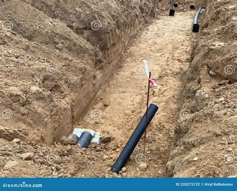 Plastic PVC Pipes Stacked In Rows At Construction Site On