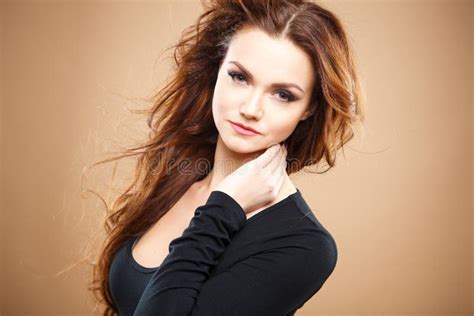 Close Up Portrait Of Beautiful Young Woman With Long Brown Hair Over