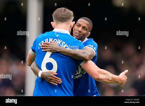 Ashley Young Of Everton Celebrates Victory With James Tarkowski During