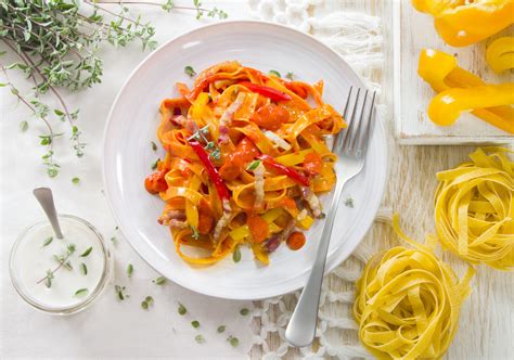 Tagliatelle With Cooking Cream And Bell Peppers Sauce And Bacon