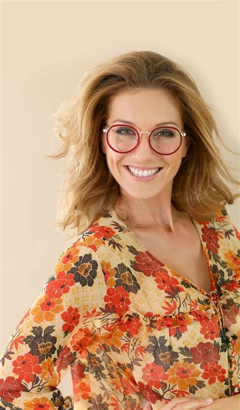 Portrait Of Smiling Mature Woman With Red Round Eyeglasses Stock Image