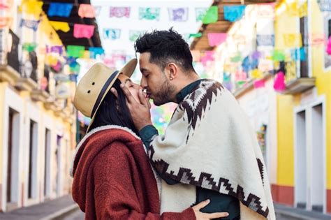 Premium Photo Latin Couple Kissing Each Other In Mexican Street