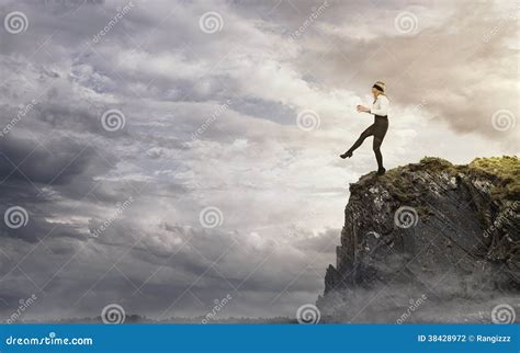 Woman Walking Off Cliff Royalty Free Stock Image