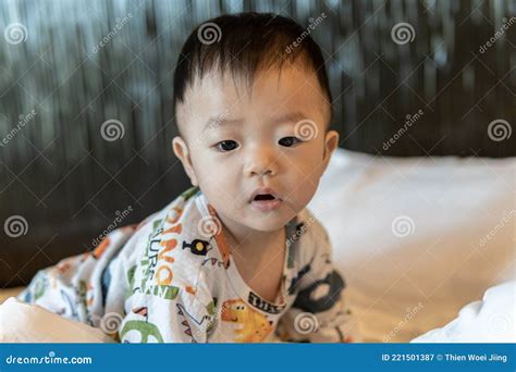 Adorable and Happy Chinese Baby Boy Child Relaxing in Bed Stock Image ...