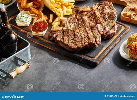 Grilled Meat Served with Side Dishes Stock Photo - Image of corn ...