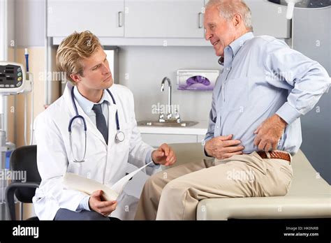 Doctor Examining Male Patient With Hip Pain Stock Photo Alamy