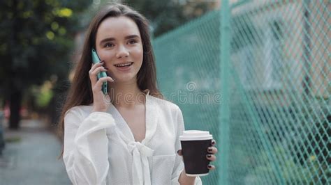 Attractive Young Smiling Brunette Caucasian Girl Walking Down Cosy Old