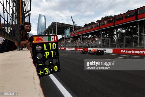 Red Bull Racings Mexican Driver Sergio Perez Steers His Car During