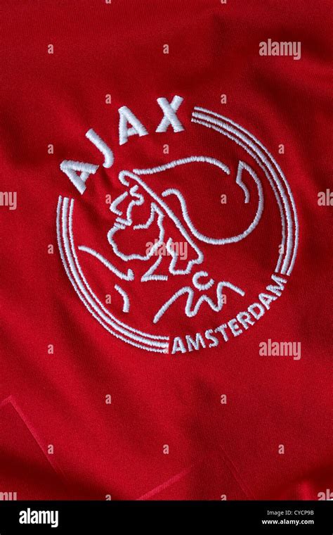 Ajax Amsterdam logo on red football shirt Stock Photo - Alamy