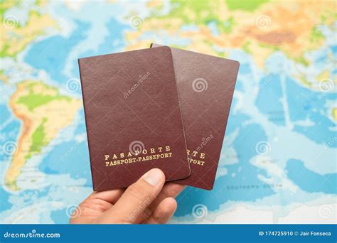 Man Holds With His Hand The Passport World Map Travel Concept Stock