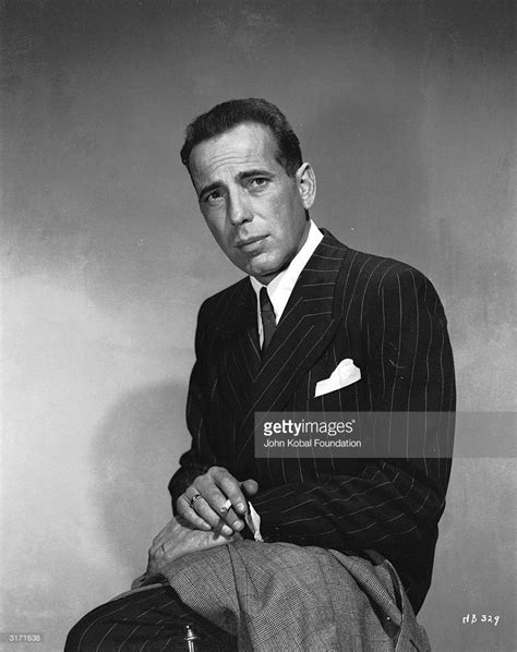 American actor Humphrey Bogart dressed in a pin-stripe suit. | American ...