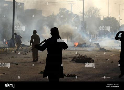 PESHAWAR PAKISTAN MAY 09 Police Fire Tear Gas To Disperse