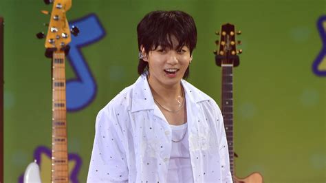 Jung Kook Of BTS Performs Stunning Debut Single ‘Seven’ Amid Inclement Weather | Access