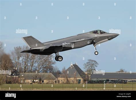 A Royal Netherlands Air Force F-35 Lightning II fighter jet landing in Leeuwarden, Netherlands ...