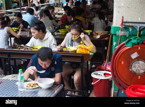 22.10.2017, Singapore, Republic of Singapore, Asia - People eat in one of the many restaurants ...