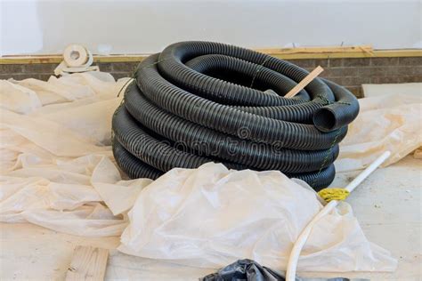 Plastic Pvc Pipes Stacked In Rows At A Construction Site On