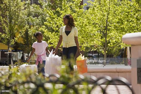 Mother And Daughter Walking Outdoors Photo Getty Images