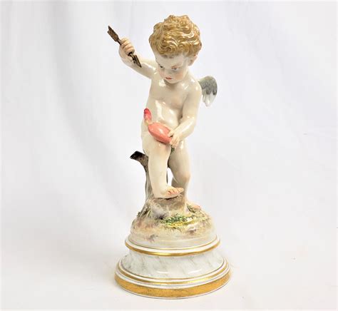 Antique Meissen Porcelain Figurine Of Cupid Holding An Arrow And