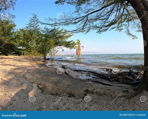 Burundi Bujumbura Lake Tanganyika Windy Cloudy Sky And Sand Beach