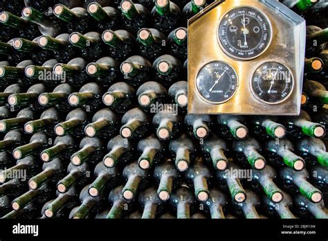 Stacked Up Dusty Wine Bottles In A Wine Cellar Stock Photo Alamy