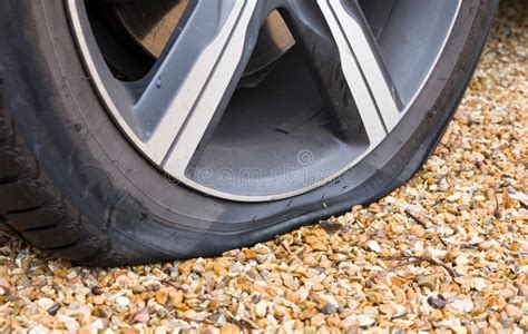 Flat Tyre Tire On A Car Wheel Close Up Of Car Tyre Puncture Stock