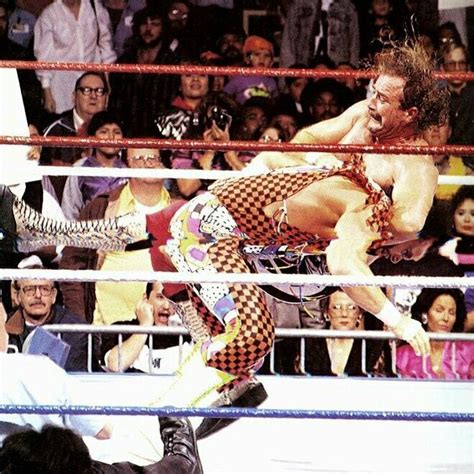 Jake The Snake Roberts With The DDT On The Macho Man Randy Savage