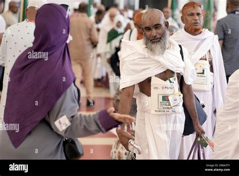 Bangladesh Pilgrims Are Greeted By A Saudi Hajj Officer As They Arrive