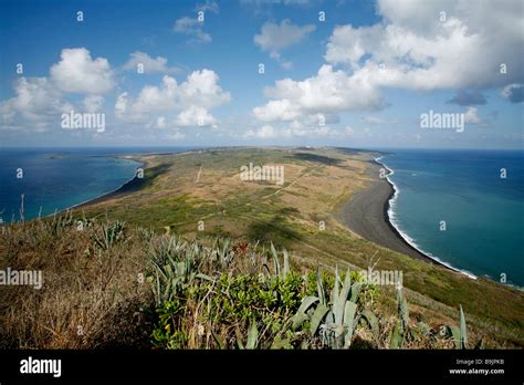 View of Iwo Jima island from the summit of Mount Suribachi with Marine Corps invasion beaches on ...