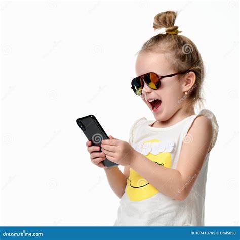 Young Girl Reading Texting Sms on the Cellphone Mobile with Touch
