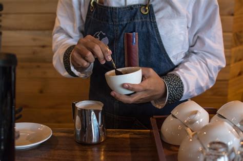 Premium Photo Barista Making A Cup Of Coffee Latte Art