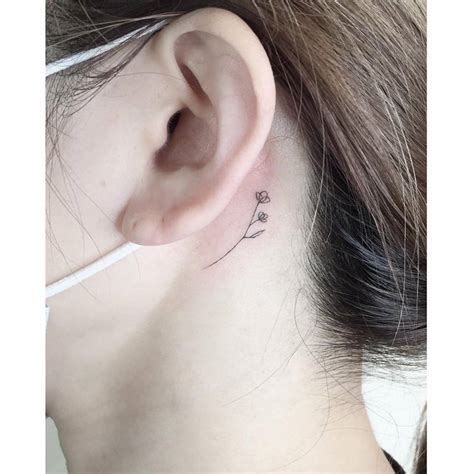 Fine Line Flowers Tattoo Done Behind The Ear