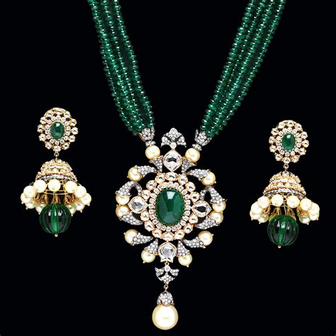 Indian Jewellery and Clothing: Emerald Pendant sets from PC Jewellers..