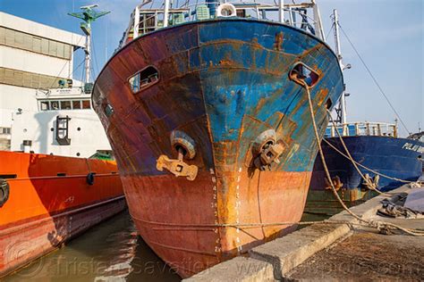 Rusted Hull of Docked Cargo Ship