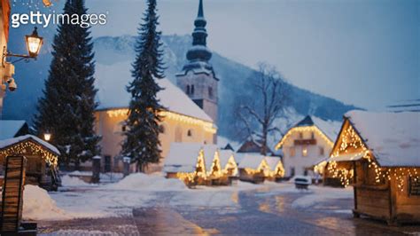 Illuminated Christmas Market And Church Of The Assumption Of Virgin