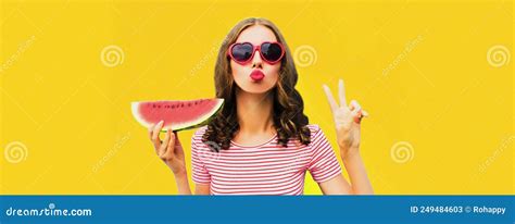 Summer Portrait Of Beautiful Young Woman Blowing Her Lips With Red