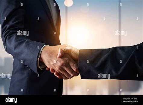 Business Agreement And Successful Negotiation Concept Businessman In Suit Shake Hand With