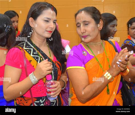 Women Wait To Join A Colourful Parade By The International Society For Krishna Consciousness