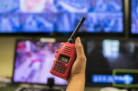 Premium Photo Close Up Of Person Holding Walkie Talkie At Control Room