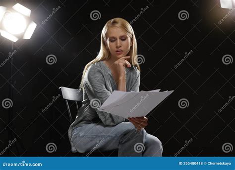 Professional Actress Reading Her Script During Rehearsal In Theatre