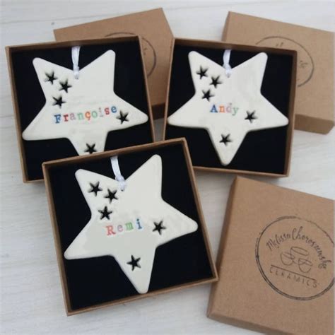 Four Decorated Cookies In Boxes On A Table