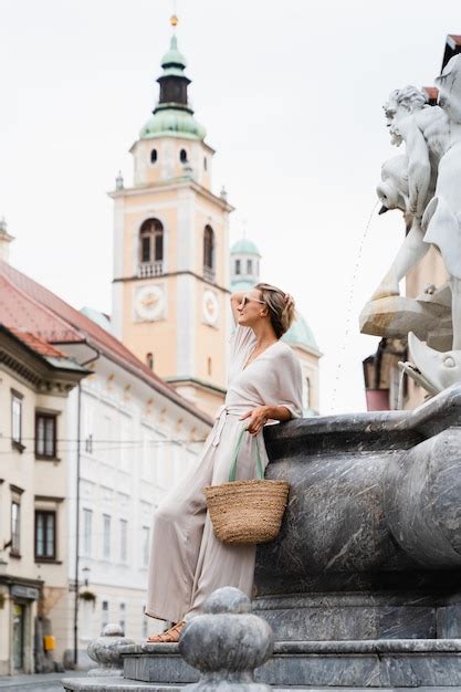 Premium Photo Smiling Woman Enjoying Walking Near The Robba Fountain