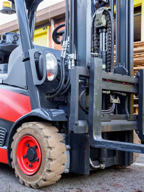 Battery Powered Electric Forklift Truck Sat In The Warehouse Yard Red