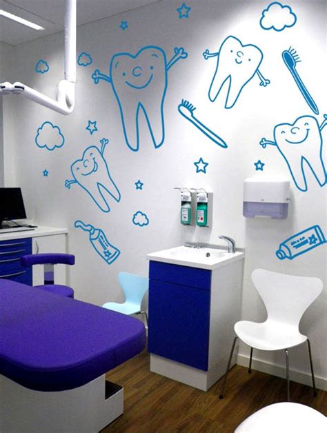 A Dentist S Office With Blue And White Wall Decals