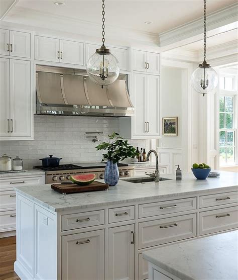 Stainless Steel Hood With White Glass Offset Tiles Transitional Kitchen