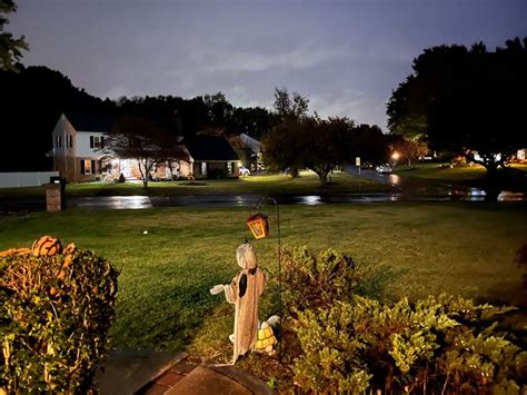 a statue in the middle of a yard at night