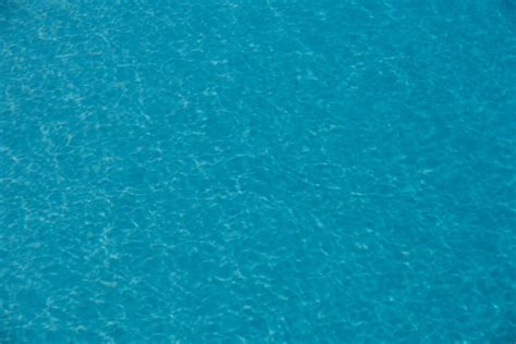 Fondo De Agua Azul En La Piscina Con Reflejo Del Sol Onda De Agua