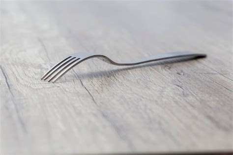 premium photo close   fork  table