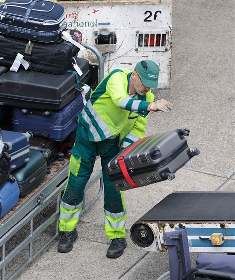 Airport Baggage Handlers Stock Image C037 8534 Science Photo Library